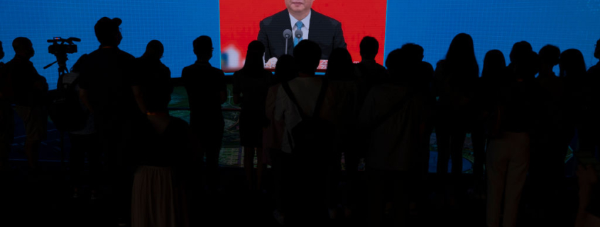 SHANGHAI, CHINA - JUNE 17: Chinese President Xi Jinping is seen on the screen during a presentation of Lingang Special Area of China, Pilot Free Trade Zone to the press during a state organized media trip on June 17, 2021 in Lingang, Shanghai, China. (Photo by Andrea Verdelli/Getty Images)