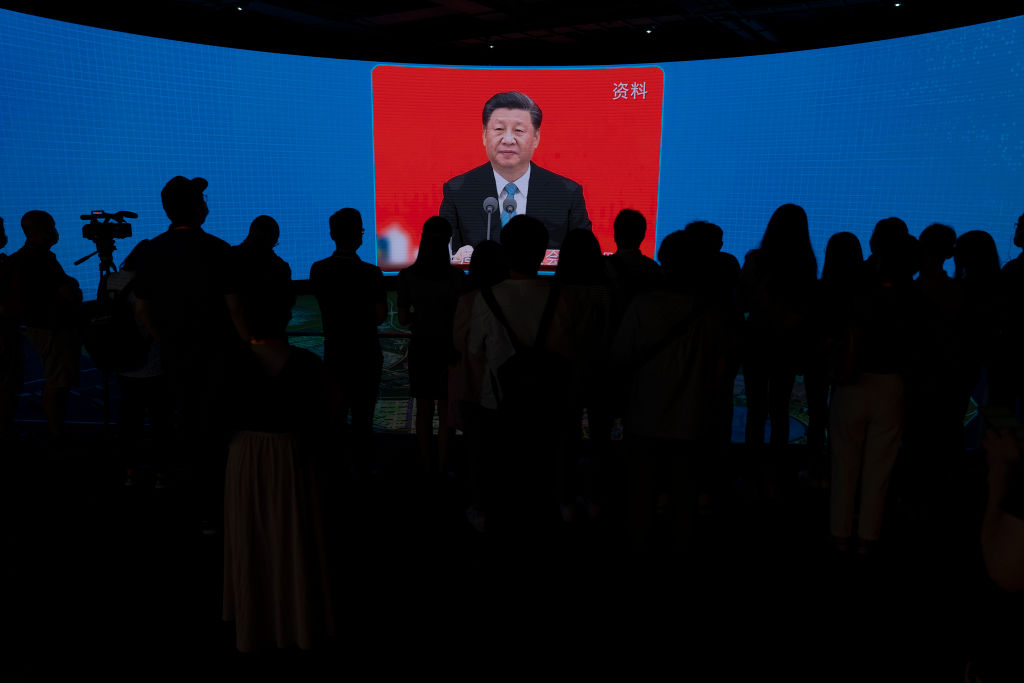 SHANGHAI, CHINA - JUNE 17: Chinese President Xi Jinping is seen on the screen during a presentation of Lingang Special Area of China, Pilot Free Trade Zone to the press during a state organized media trip on June 17, 2021 in Lingang, Shanghai, China. (Photo by Andrea Verdelli/Getty Images)