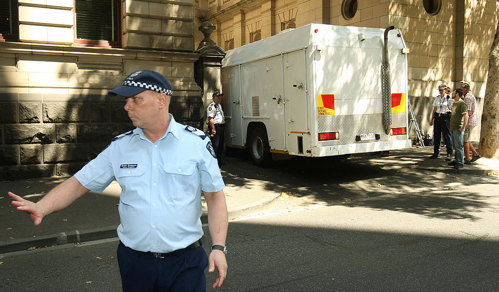 Muslim cleric Abdul Nacer Benbrika and six followers are taken from the Supreme Court by prison truck after they were jailed for up to 15 years after being found guilty of forming an Australian terror cell which plotted bomb attacks designed to kill thousands in Melbourne on February 3, 2009. Benbrika, 48, was jailed for 15 years, of which he must serve at least 12 years, while his followers received minimum terms of between four and seven-and-a-half years. Algerian-born Benbrika had urged them to target large crowds at football matches or a train station to pressure the Australian government to withdraw its soldiers from Iraq and Afghanistan, the court heard. AFP PHOTO/William WEST (Photo credit should read WILLIAM WEST/AFP via Getty Images)