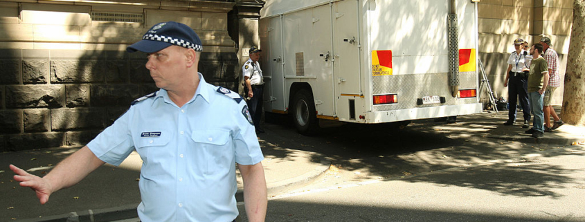 Muslim cleric Abdul Nacer Benbrika and six followers are taken from the Supreme Court by prison truck after they were jailed for up to 15 years after being found guilty of forming an Australian terror cell which plotted bomb attacks designed to kill thousands in Melbourne on February 3, 2009. Benbrika, 48, was jailed for 15 years, of which he must serve at least 12 years, while his followers received minimum terms of between four and seven-and-a-half years. Algerian-born Benbrika had urged them to target large crowds at football matches or a train station to pressure the Australian government to withdraw its soldiers from Iraq and Afghanistan, the court heard. AFP PHOTO/William WEST (Photo credit should read WILLIAM WEST/AFP via Getty Images)