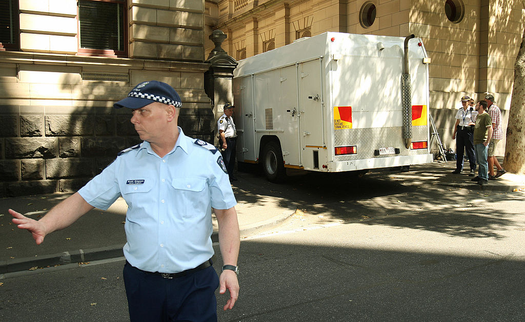 Muslim cleric Abdul Nacer Benbrika and six followers are taken from the Supreme Court by prison truck after they were jailed for up to 15 years after being found guilty of forming an Australian terror cell which plotted bomb attacks designed to kill thousands in Melbourne on February 3, 2009. Benbrika, 48, was jailed for 15 years, of which he must serve at least 12 years, while his followers received minimum terms of between four and seven-and-a-half years. Algerian-born Benbrika had urged them to target large crowds at football matches or a train station to pressure the Australian government to withdraw its soldiers from Iraq and Afghanistan, the court heard. AFP PHOTO/William WEST (Photo credit should read WILLIAM WEST/AFP via Getty Images)