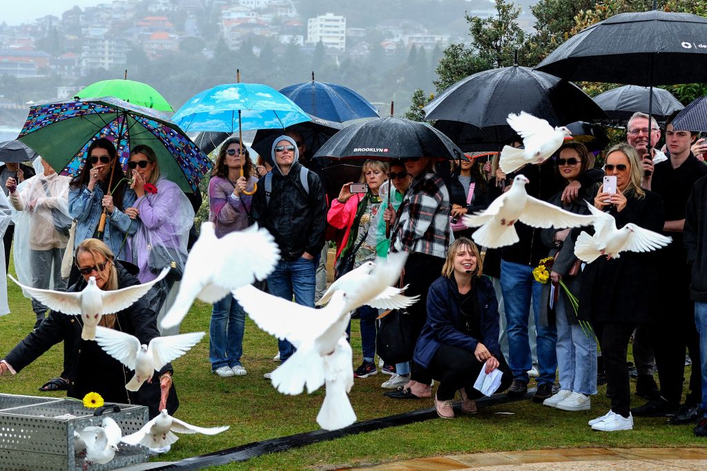 Doves are released during a commemoration ceremony to mark the 20th anniversary of the Bali bombings, at Coogee Beach in Sydney on October 12, 2022. (Photo by DAVID GRAY / AFP) (Photo by DAVID GRAY/AFP via Getty Images)