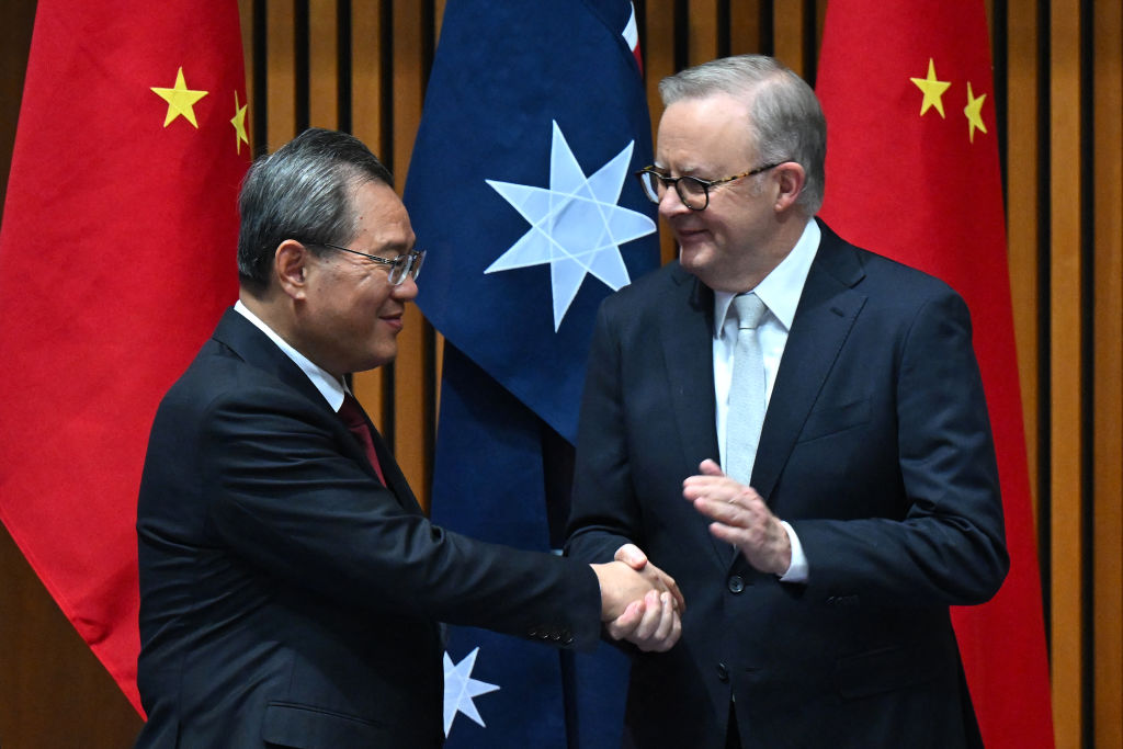 Image shows China’s Premier Li Qiang and Australia’s Prime Minister Anthony Albanese during a signing ceremony at Parliament House in Canberra. Photo: Lukas Coch/Getty Images