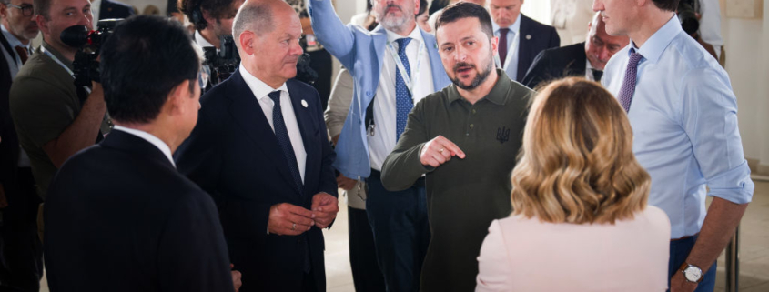 Image shows Ukraine President Volodymyr Zelensky speaking with G7 leaders in Italy this week. Photo by Steffen Kugler/Bundesregierung via Getty Images.