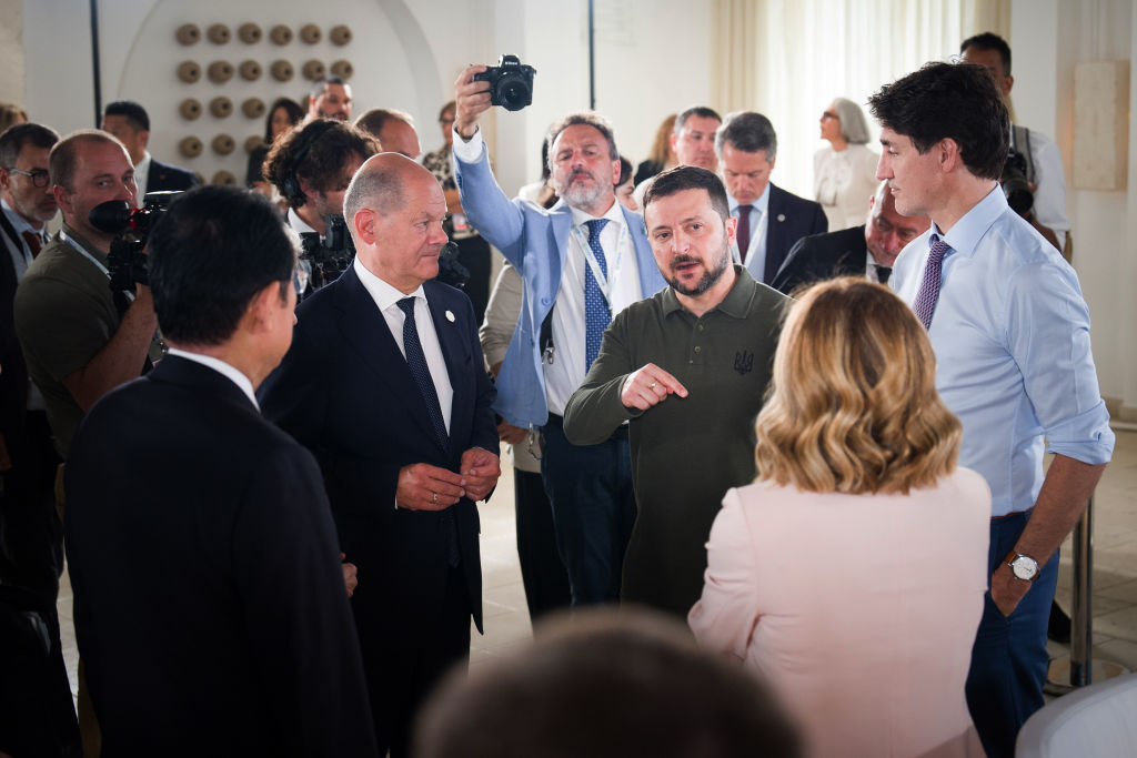 Image shows Ukraine President Volodymyr Zelensky speaking with G7 leaders in Italy this week. Photo by Steffen Kugler/Bundesregierung via Getty Images.