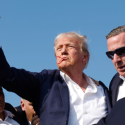 BUTLER, PENNSYLVANIA - JULY 13: Republican presidential candidate former President Donald Trump pumps his fist as he is rushed offstage during a rally on July 13, 2024 in Butler, Pennsylvania. Butler County district attorney Richard Goldinger said the shooter is dead after injuring former U.S. President Donald Trump, killing one audience member and injuring another in the shooting. (Photo by Anna Moneymaker/Getty Images)